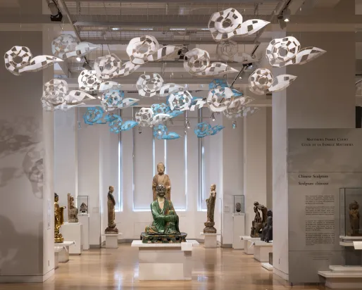 Cloudscape By Xiaojing Yan Paper clouds floating above Chinese statues