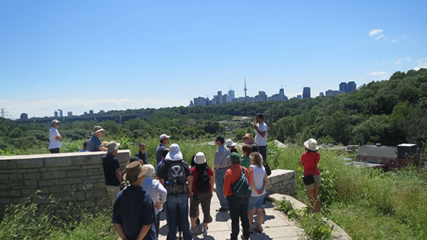 Don Valley lookout from which you can see the whole north slope of sediments (and the downtown skyline).
 Group stands with Toronto skyline in Background