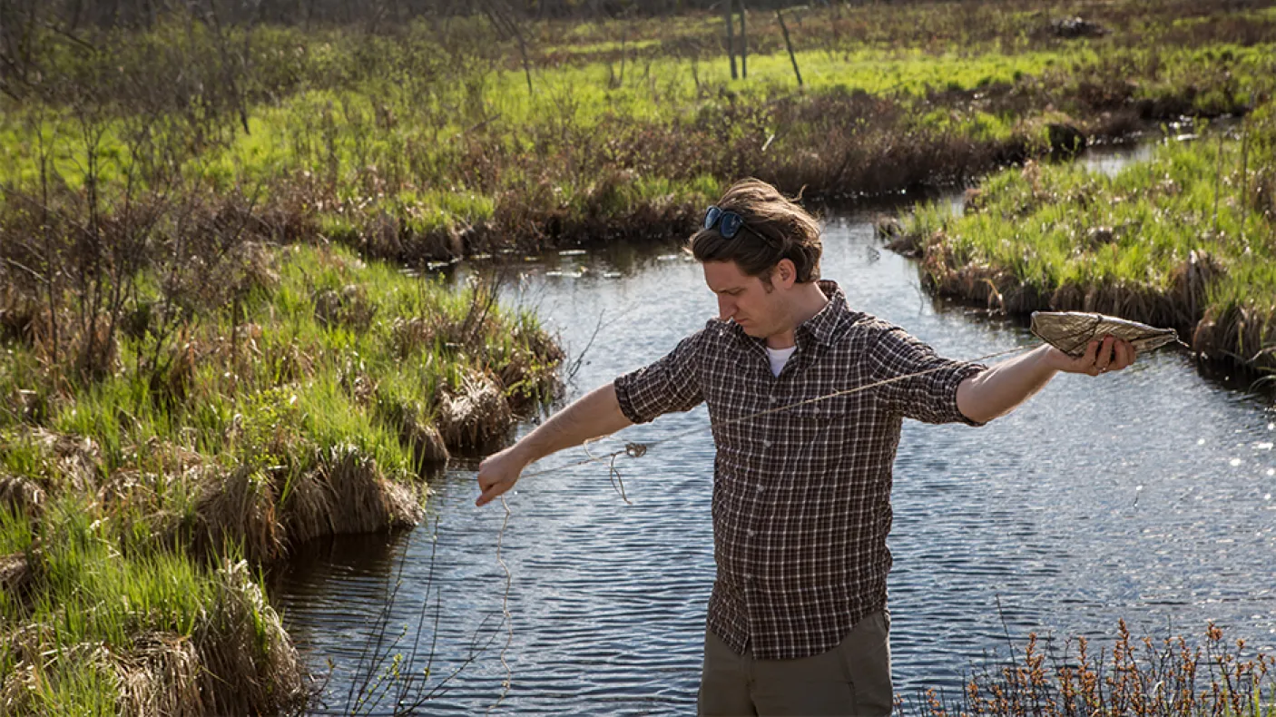 Sebastian Kvist setting a leech trap in Lake Vermilion. Photo by Vincent Luk.
 Sebastian Kvist setting a leech trap in Lake Vermilion.