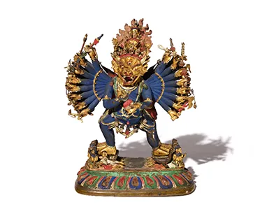 A golden statue of a dragon looking face. A golden statue of a dragon looking face.