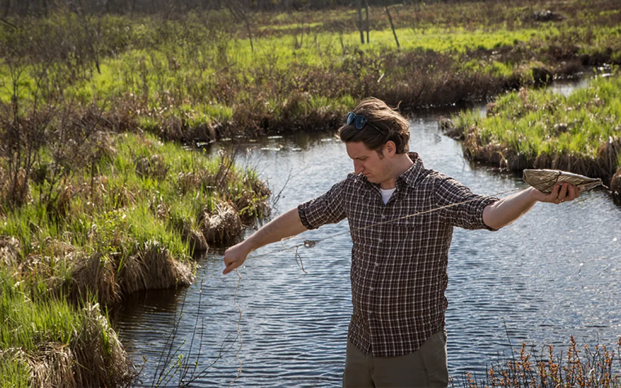 Sebastian Kvist setting a leech trap in Lake Vermilion. Photo by Vincent Luk.
 Sebastian Kvist setting a leech trap in Lake Vermilion.
