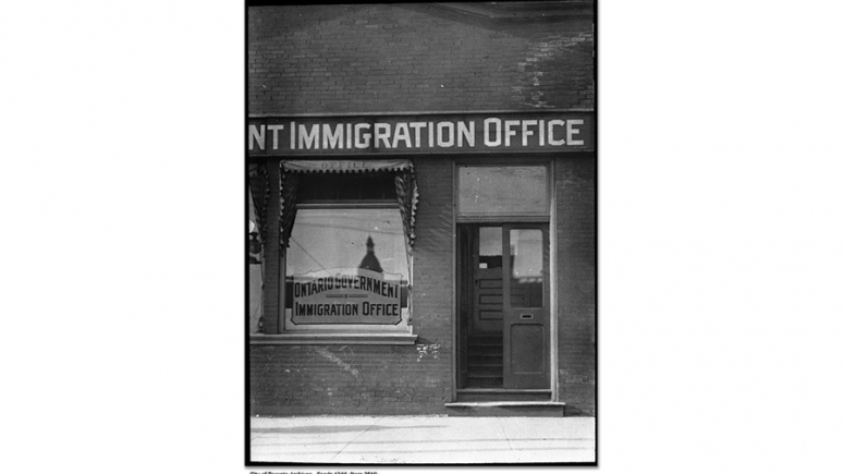 The exterior of an immigration office in the early 20th century.