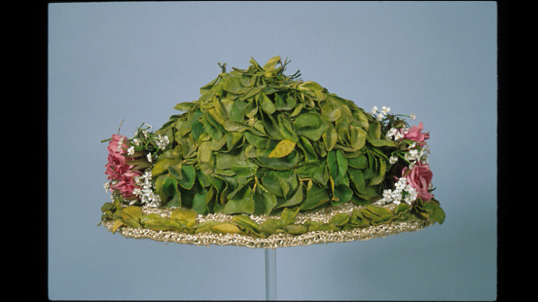 Woman's hat. Used in Canada. Straw with imitation leaves and flowers. c. 1910. 963.9.20. Gift of Miss Adelaide Lash Miller.