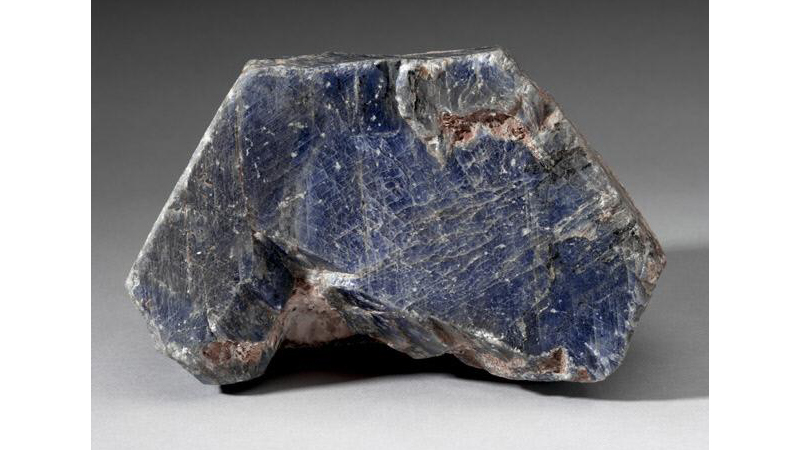 Uncut gemstone with blue hue.