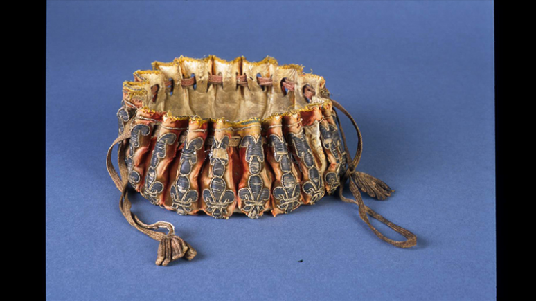 Alms purse. Perhaps made in France. 17th century. Silk velvet embroidered with silver filé laid over parchment. 930.13.3.