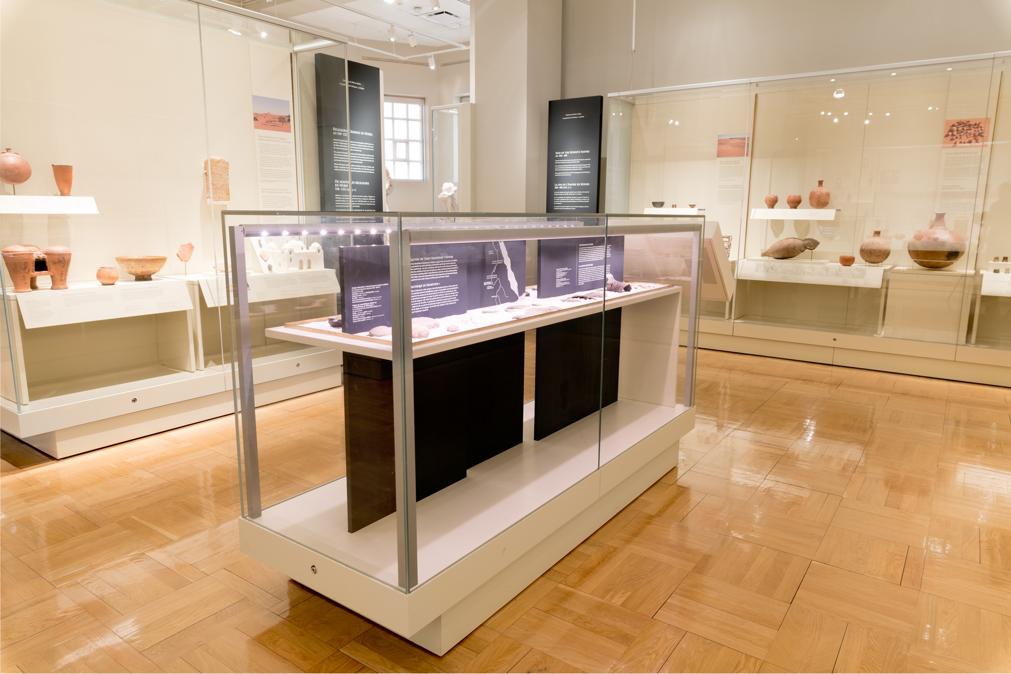 A gallery displaying a collection of African objects including pottery.