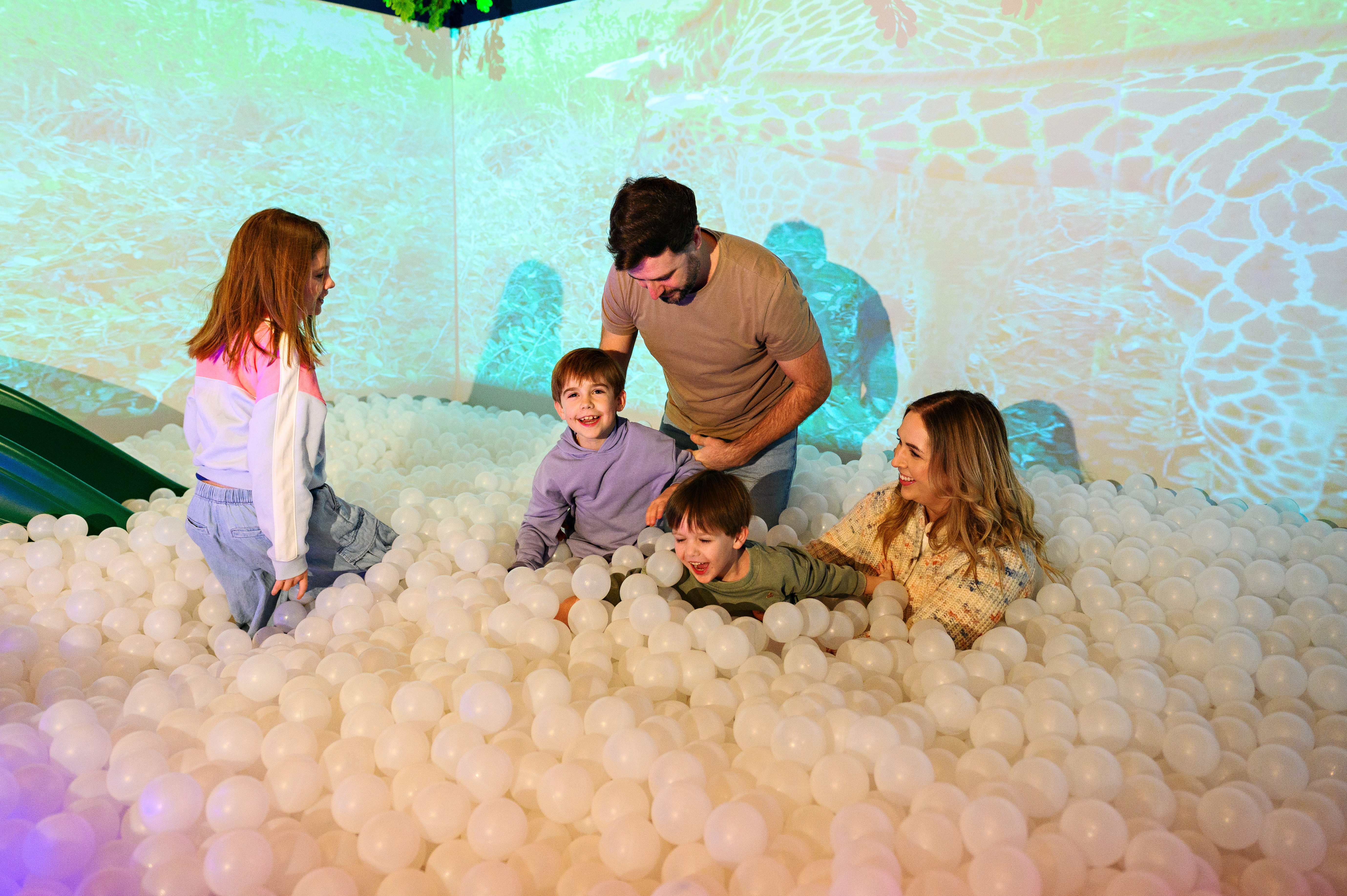 Family in ball pit at THEMUSEUM