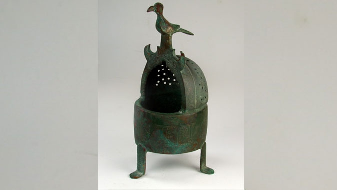 Used to fill a space with pleasant scent, incense burners belonged in every well-to-do household. This one, made of bronze in Eastern Iran (12th-13th centuries) displays various types of decoration: bands with inscriptions, arabesque ornaments in medallions and the figure of a bird perched on top of the “hood.”