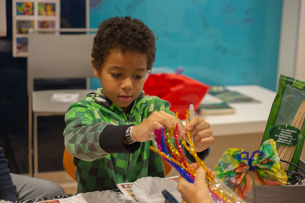 A child at the Hospital for Sick children enjoys a craft