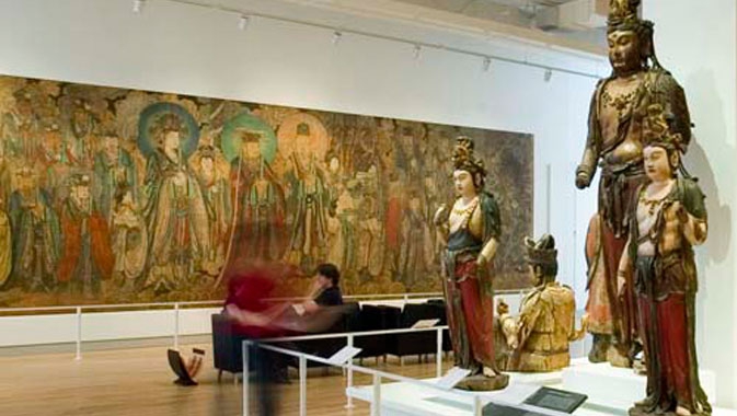 Bishop White Gallery of Chinese Temple Art, showing wooden Buddhist sculptures and wall murals in the ROM gallery