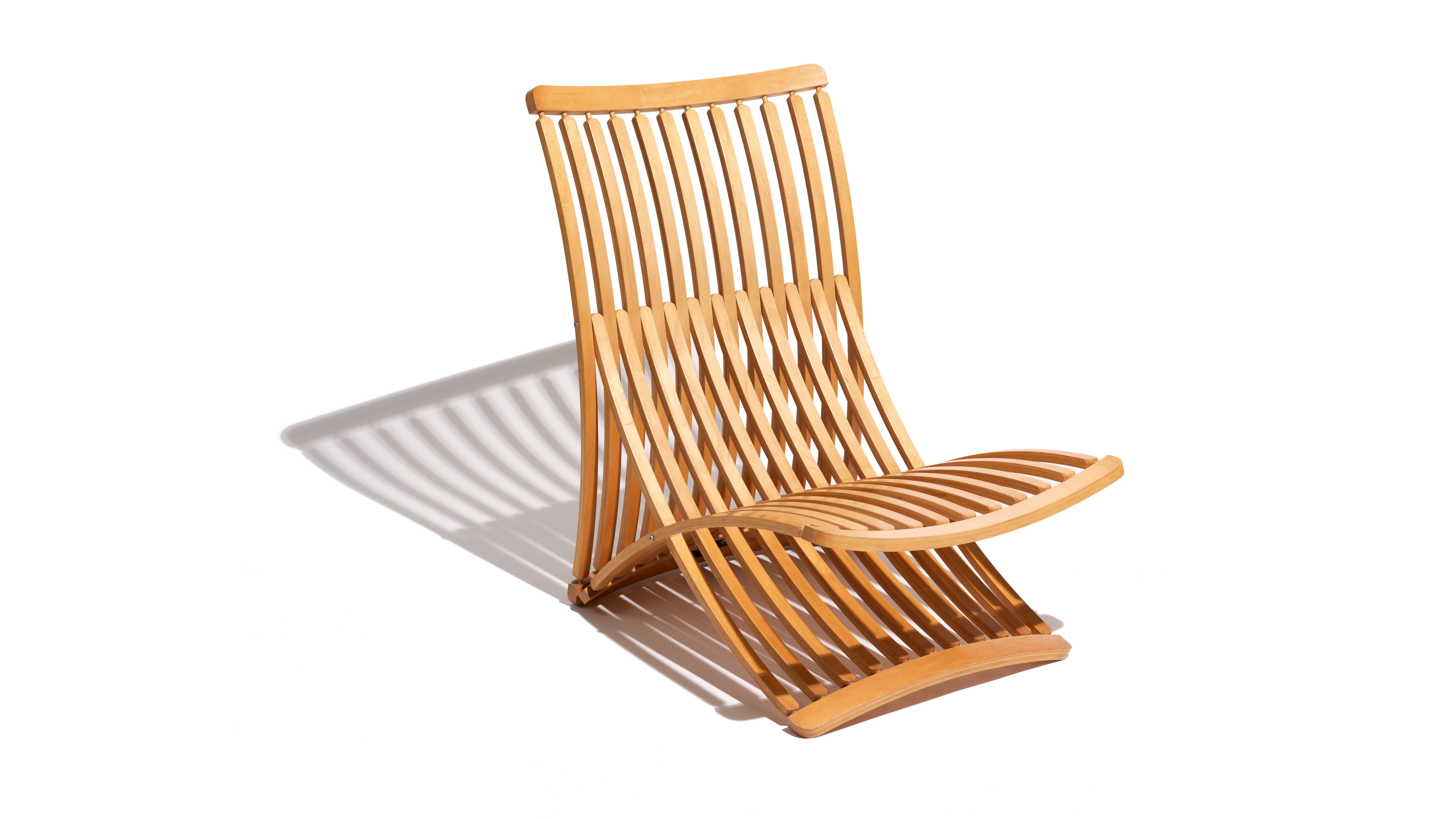  Armless chair made of multiple, steam-bent wooden slats.