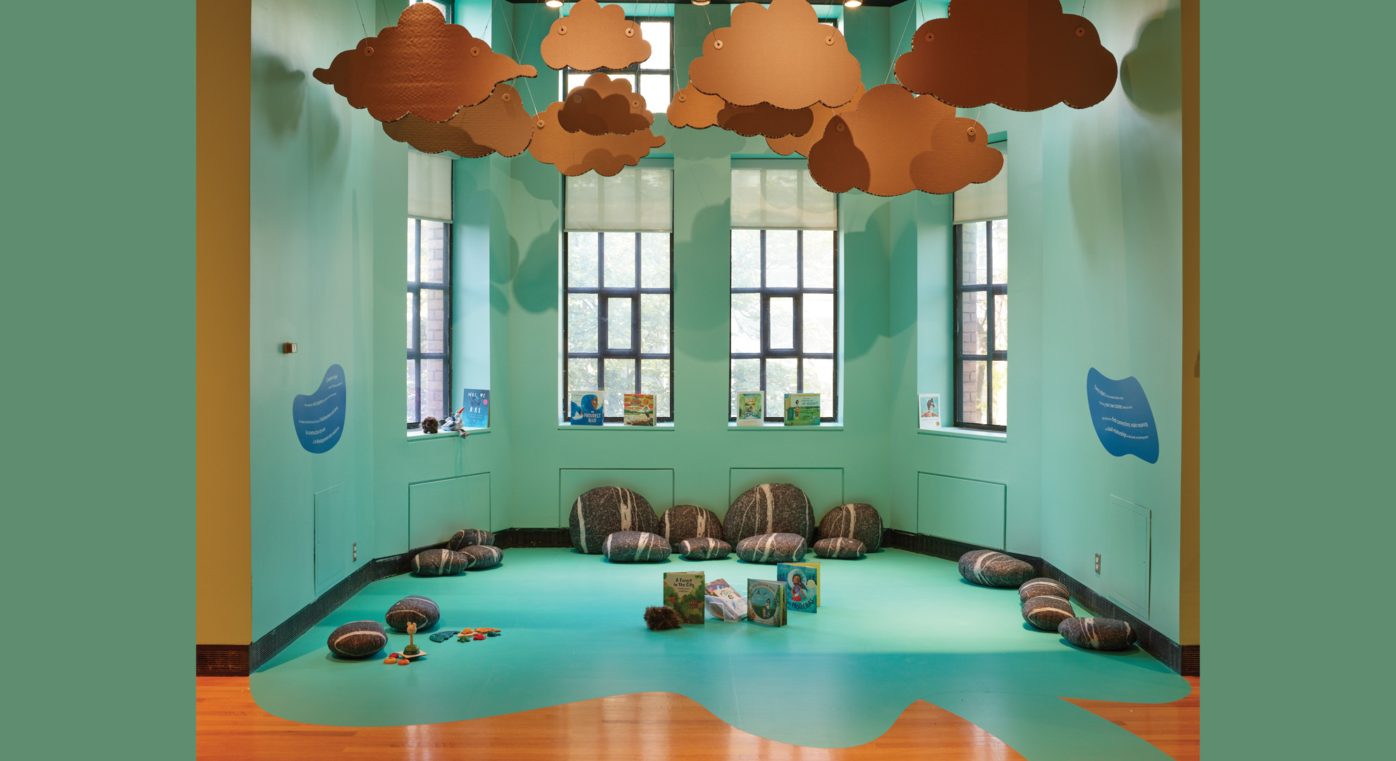 WonderWorks' story nook creates a calm oasis of learning engagement, full of books, clouds, and pillows.