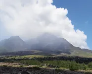 A cloud of sulphuric gases surround a volcano