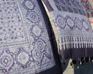 Chintz fabrics on a clothesline.
