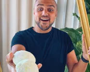 Kiron holding today's activity, fizzing dinosaur eggs