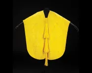 Yellow cape made from golden orb spider silk