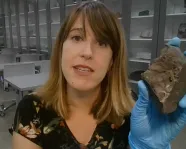 Veronica DiCecco holding asteroid.
