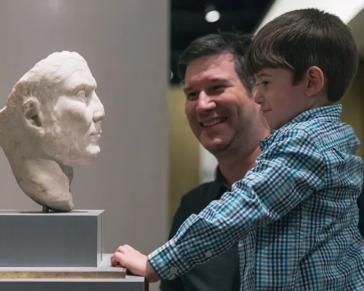 Father and son enjoying ROM sculpture