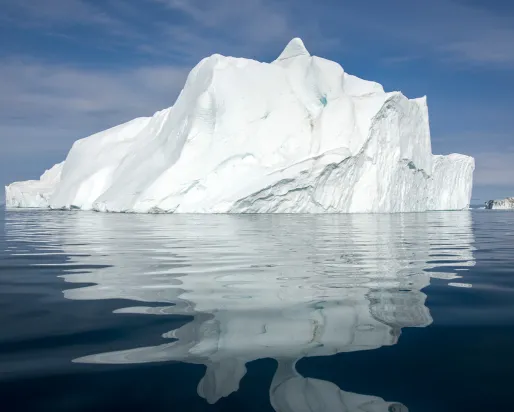 An iceberg in the water off the coast of Greenland.
