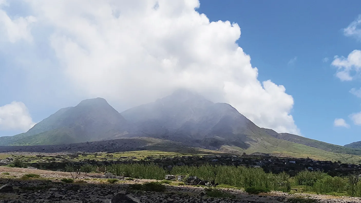 A cloud of sulphuric gases surround a volcano