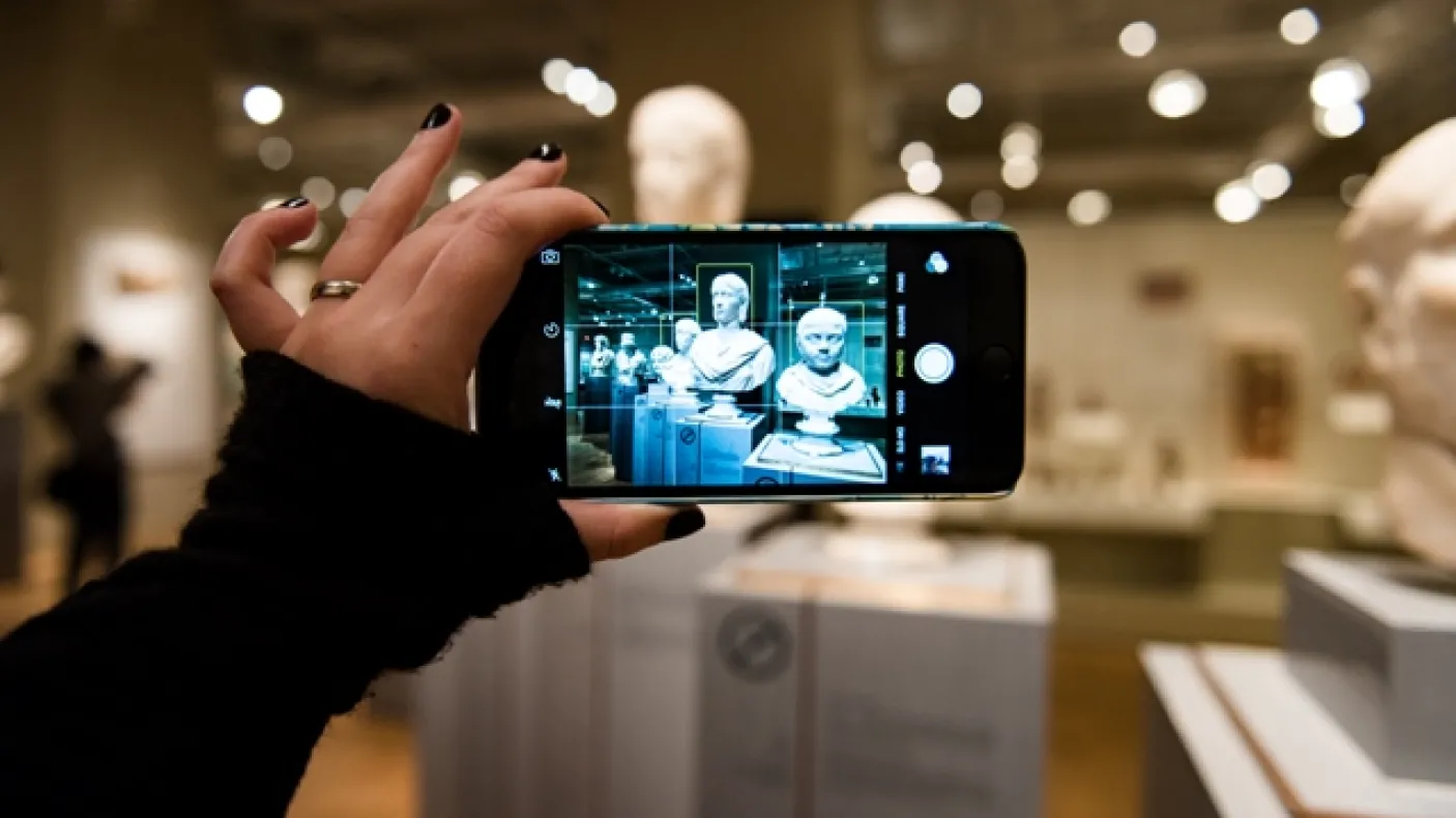Photo courtesy of KMR Photography.
 Image of a visitor taking a photo on a smartphone