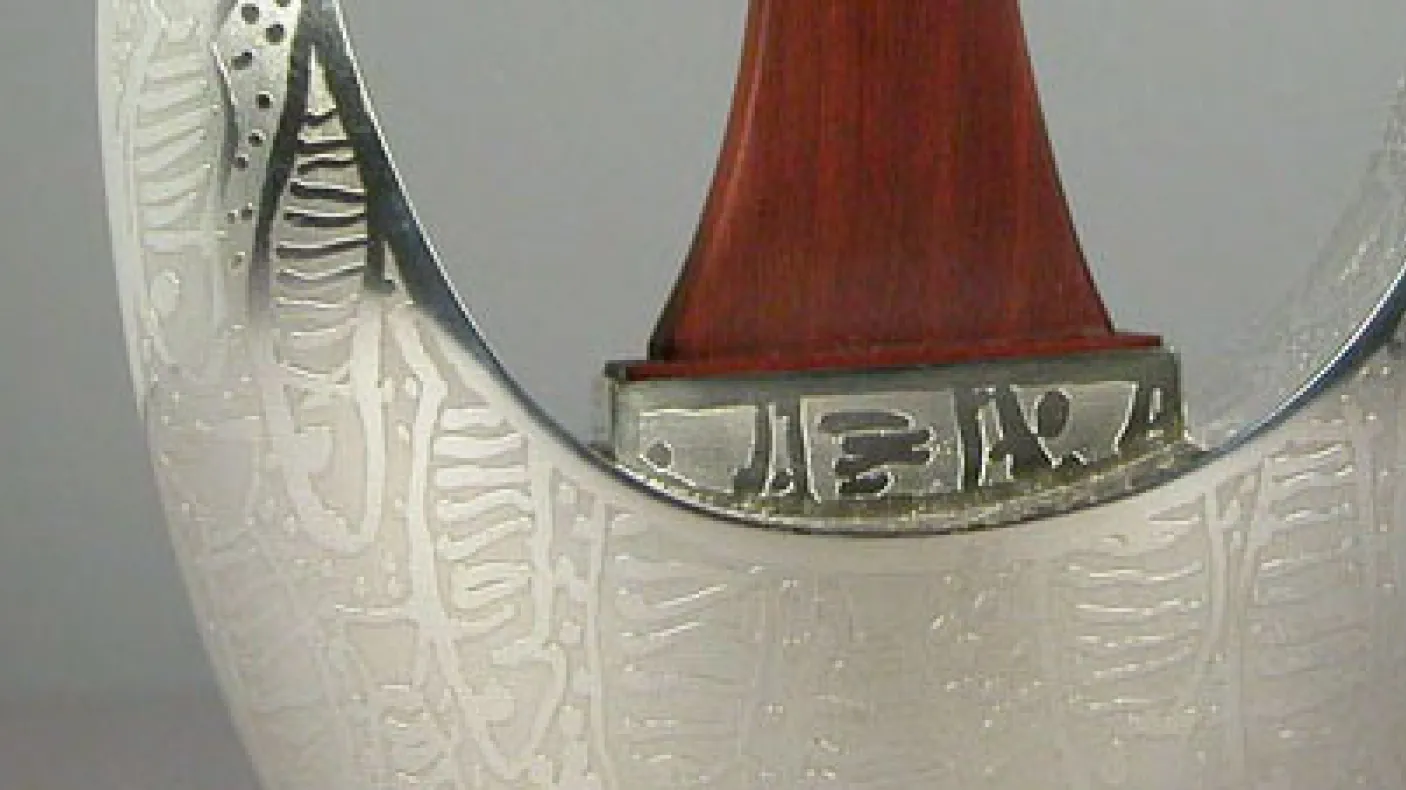 Detail of Michael Massie teapot. ROM Accession: 2009.30.1.1-.2
 detail of silver teapot