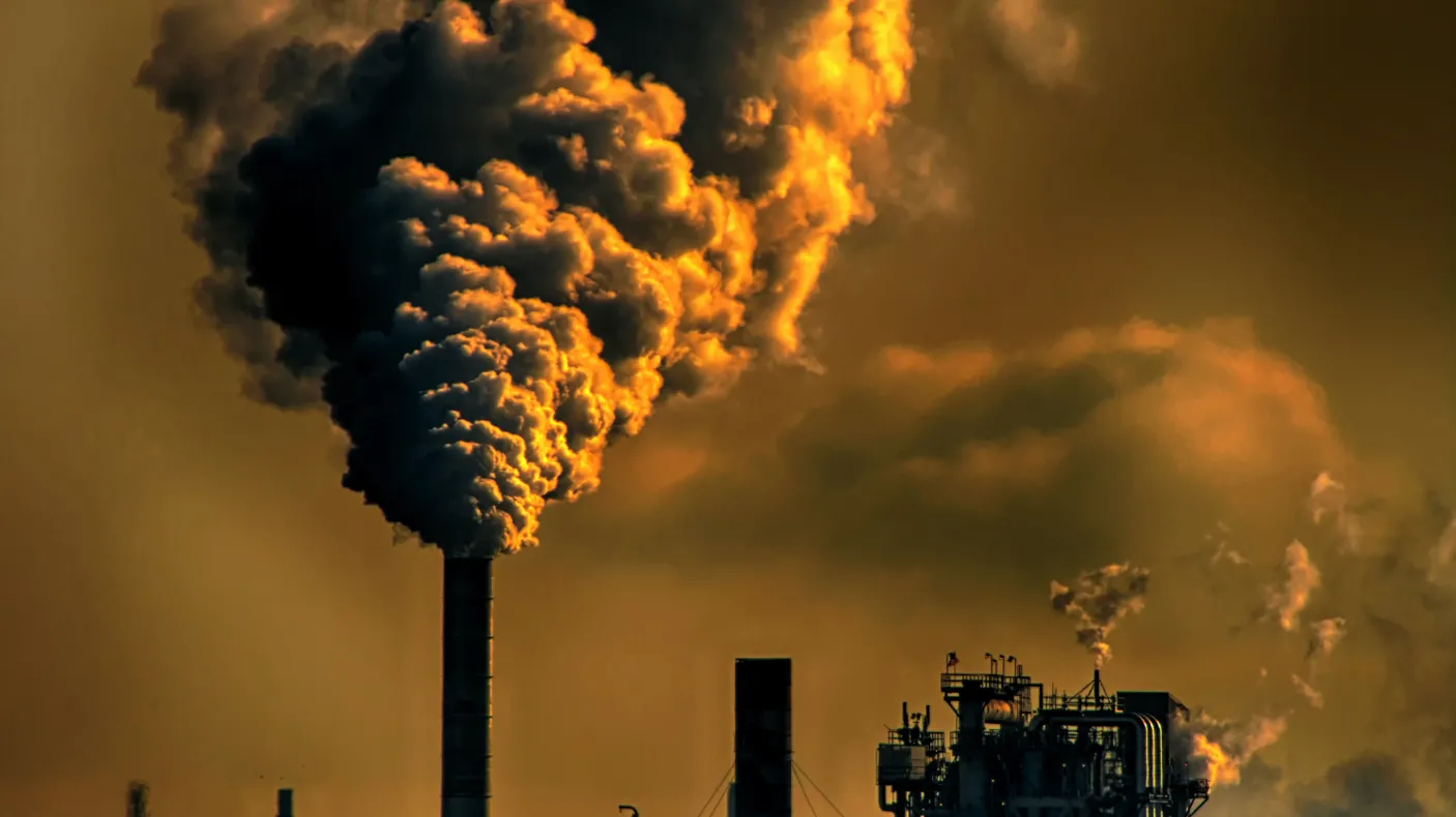 Smoke cloud coming out of a factory's chimney.