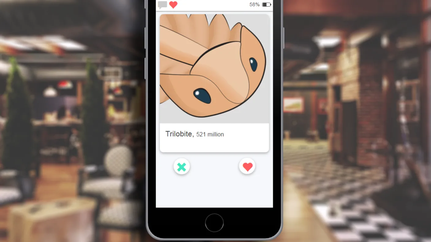 a phone displays a dating app with a picture of a trilobite
