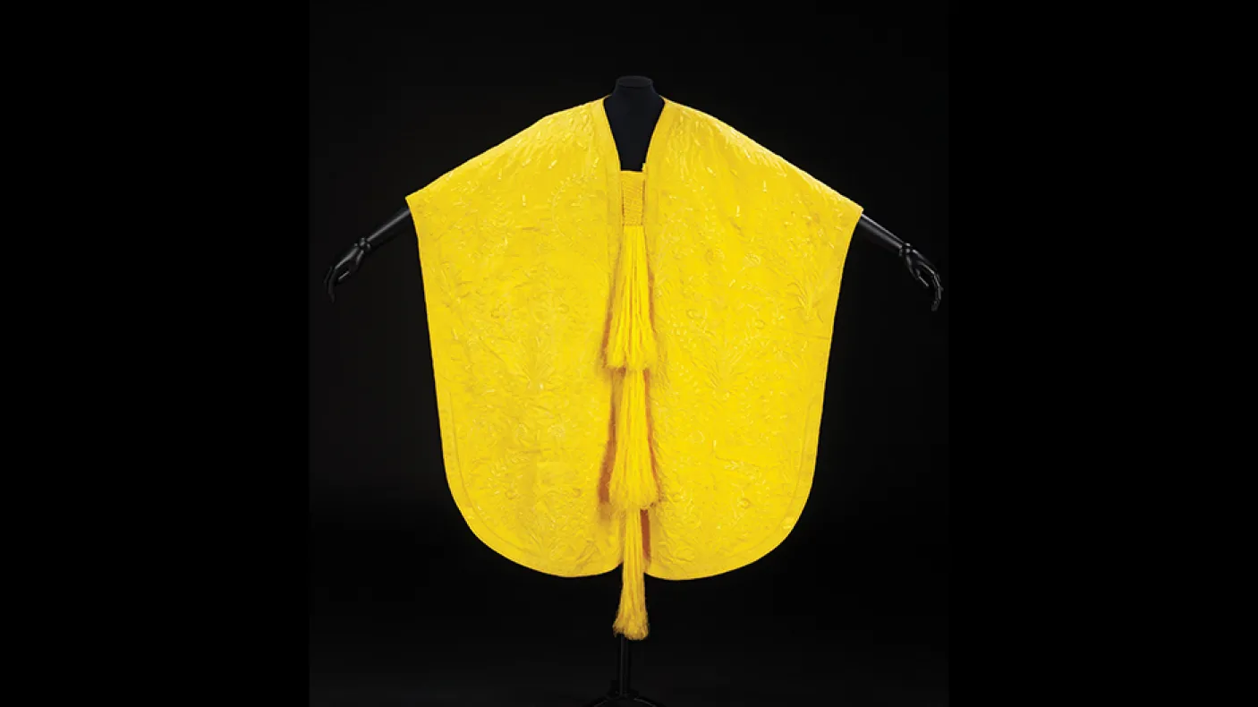 Yellow cape made from golden orb spider silk