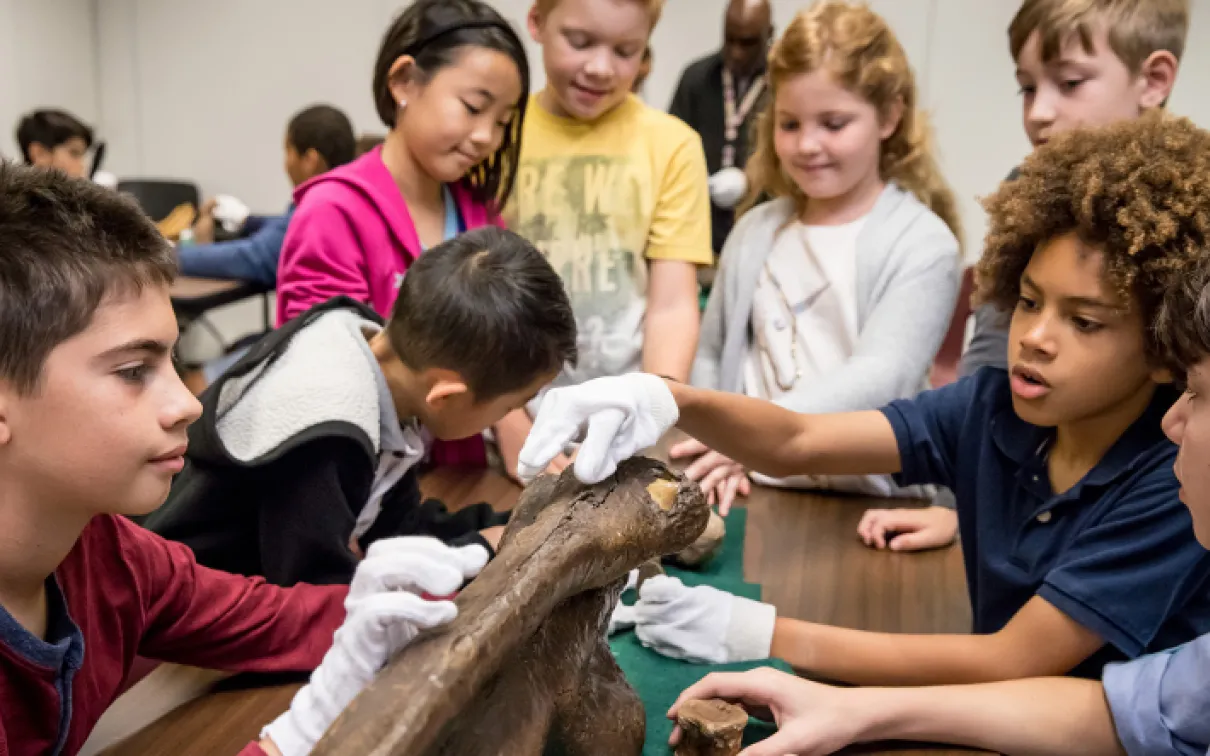 Kids with fossil bone