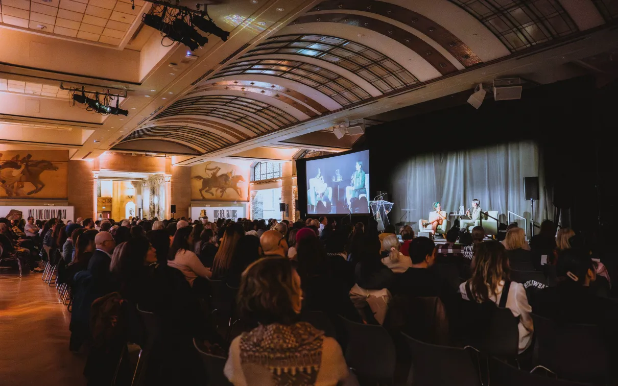 Crowd of people sitting at a ROM Speaks event