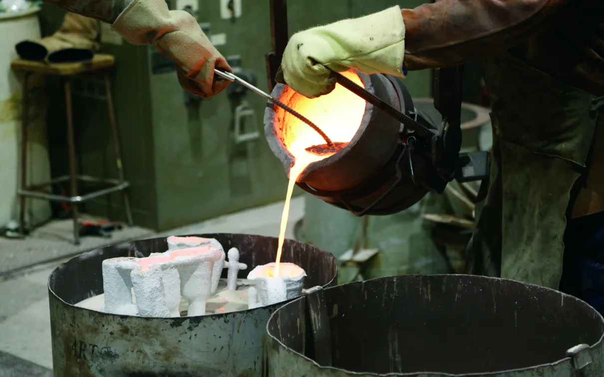 The bronze being poured.