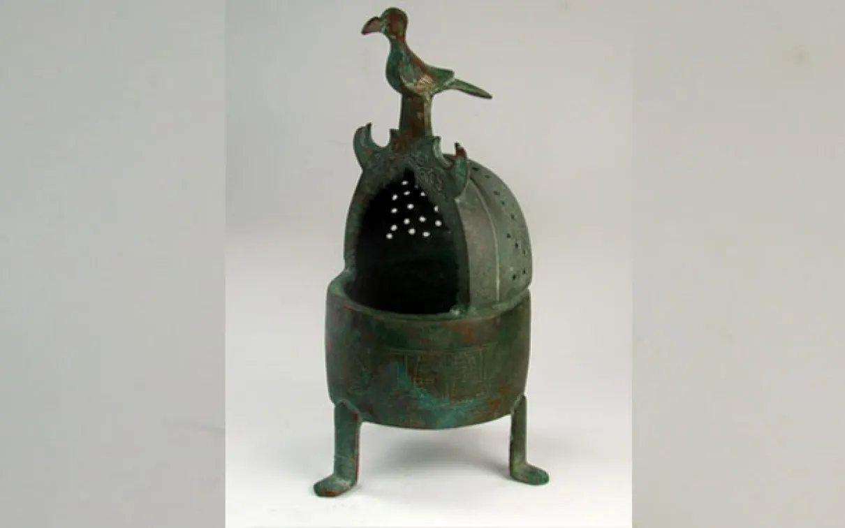 Used to fill a space with pleasant scent, incense burners belonged in every well-to-do household. This one, made of bronze in Eastern Iran (12th-13th centuries) displays various types of decoration: bands with inscriptions, arabesque ornaments in medallions and the figure of a bird perched on top of the “hood.”