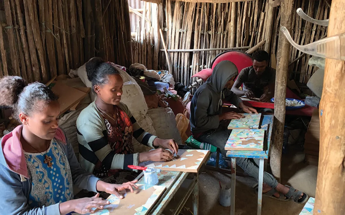 Assistants working in Elias Sime’s studio.