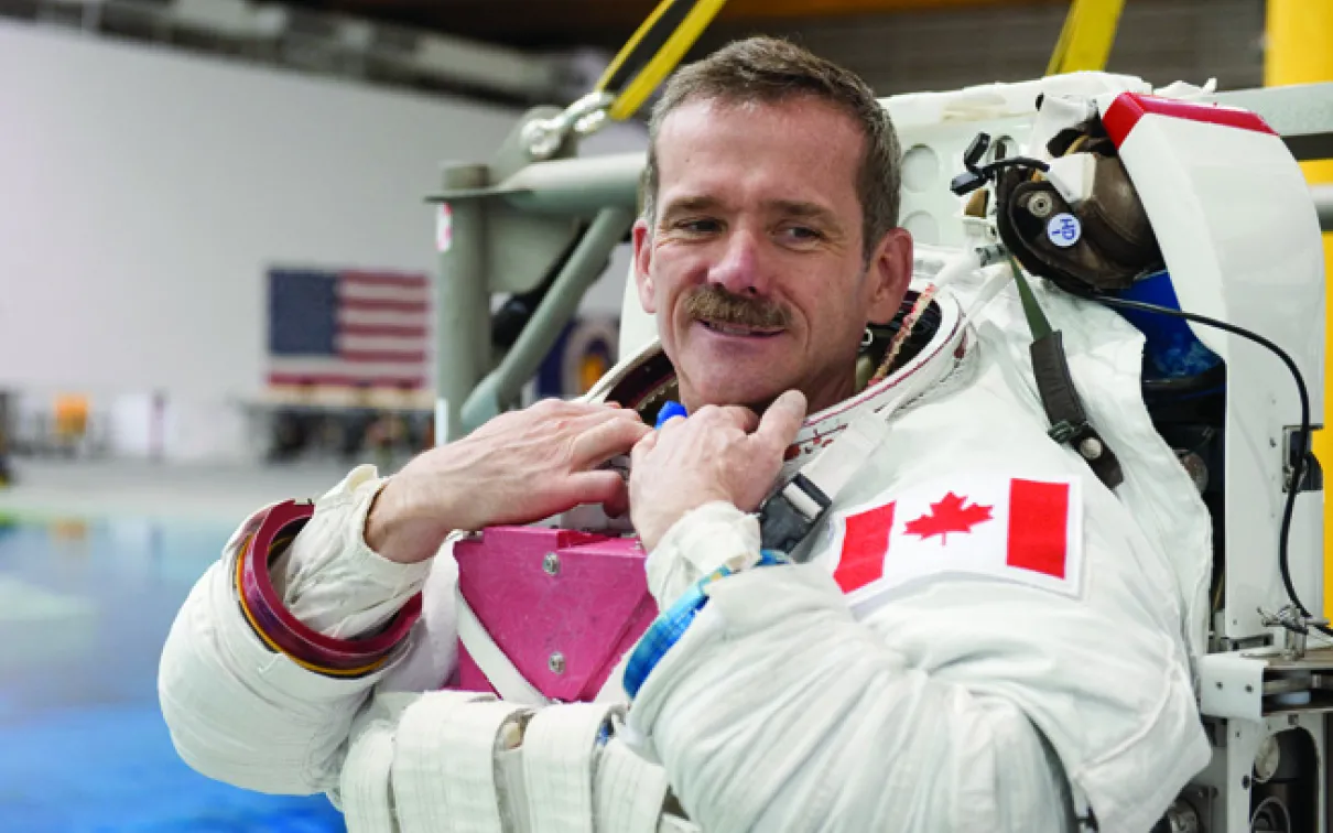 Chris Hadfield in his astronaut suit
 A photograph of a man in an astronaut suit without a helmet
