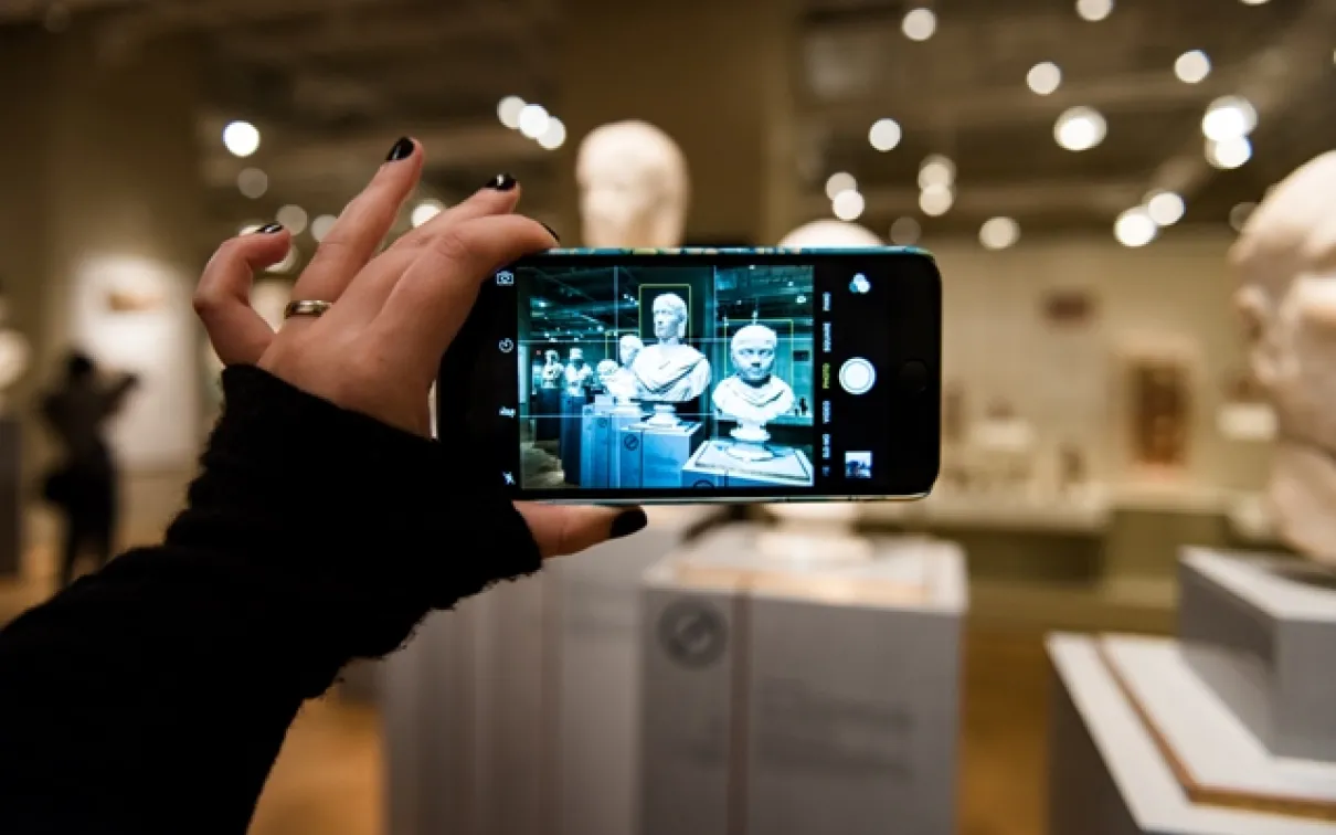 Photo courtesy of KMR Photography.
 Image of a visitor taking a photo on a smartphone