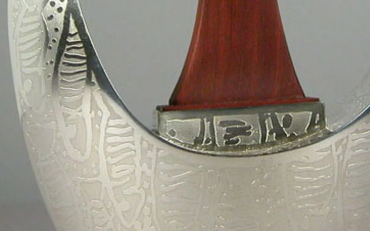 Detail of Michael Massie teapot. ROM Accession: 2009.30.1.1-.2
 detail of silver teapot