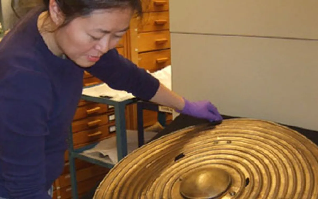 Re-seating a rare Bronze Age shield in collections storage
