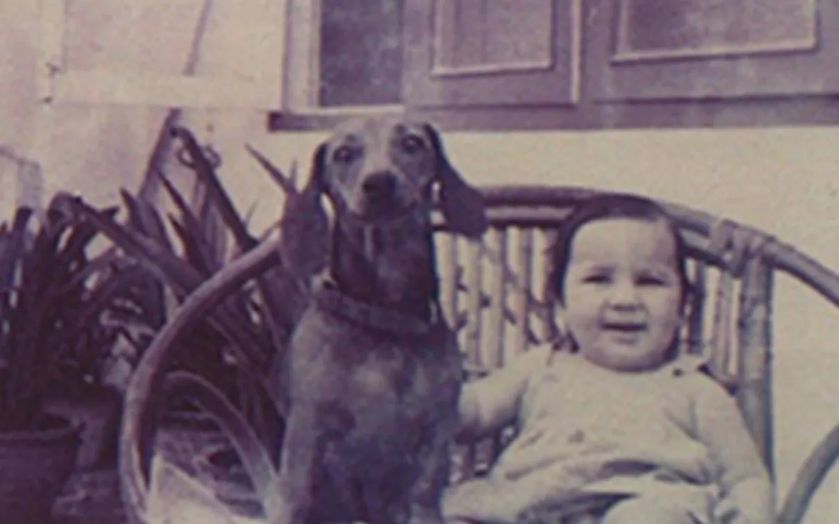 Deepali Dewan with her dog Tipsy on a wicker garden chair.