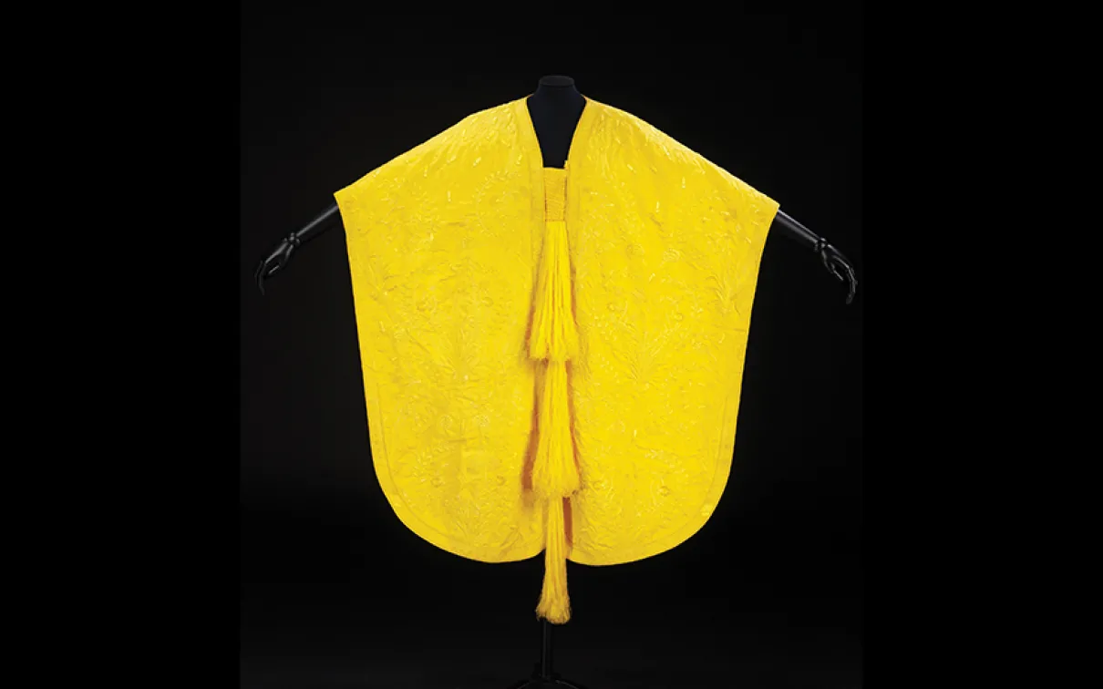 Yellow cape made from golden orb spider silk