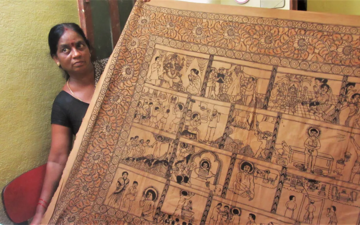 Woman holding a printed textile.