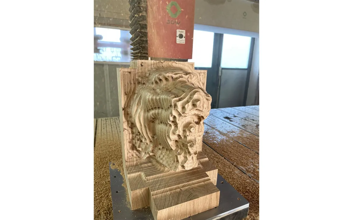 Sculpture being carved by an axis CNC carving maxhine.