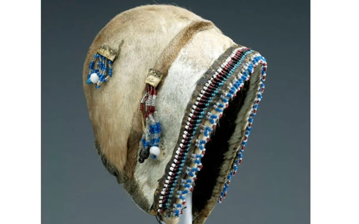 Robert J. Flaherty (1884-1951) was commissioned by the Canadian Northern Railway to find iron-ore deposits along the northeast coast of Hudson Bay. He visited the Arctic over several years and collected a wide range of Inuit artifacts, such as this child's summer bonnet made of caribou skin decorated with beadwork.