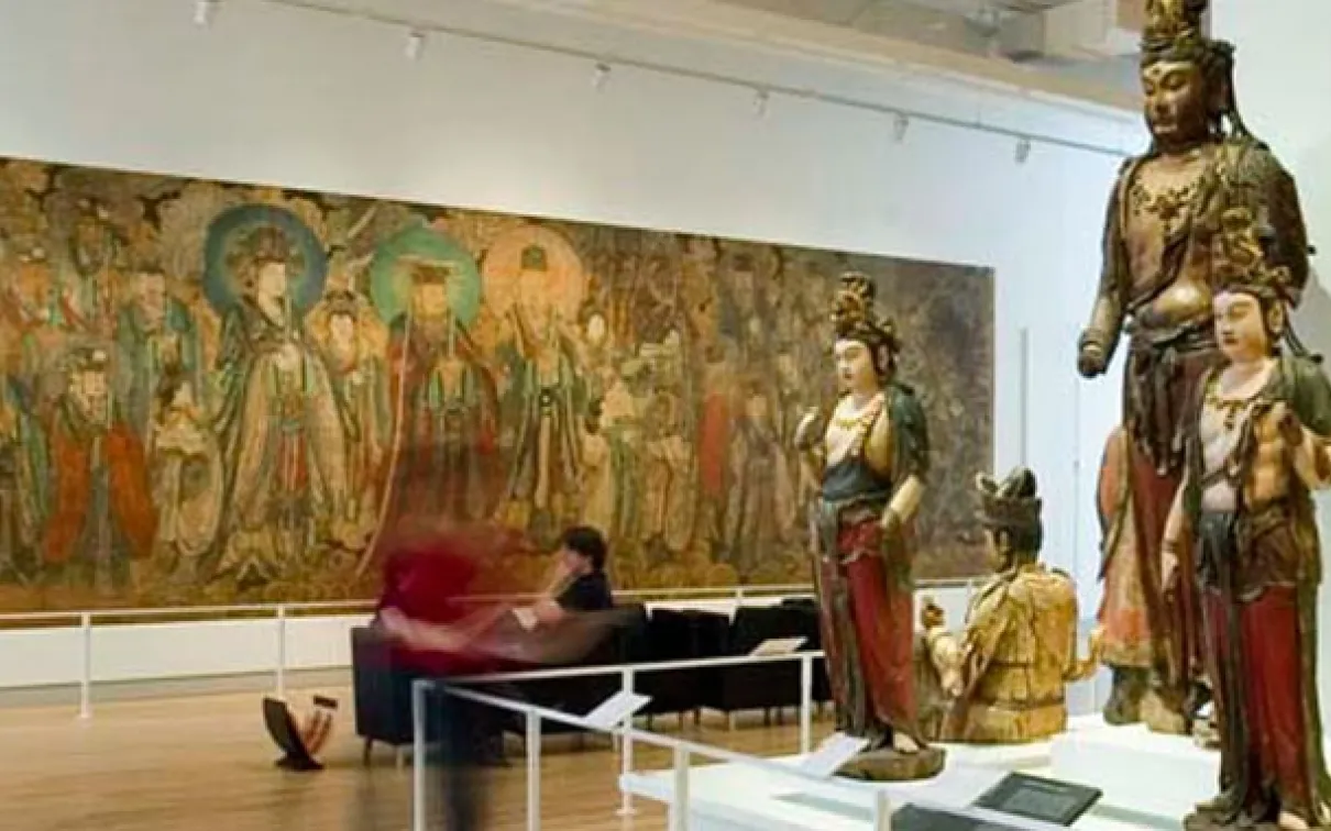 Bishop White Gallery of Chinese Temple Art, showing wooden Buddhist sculptures and wall murals in the ROM gallery