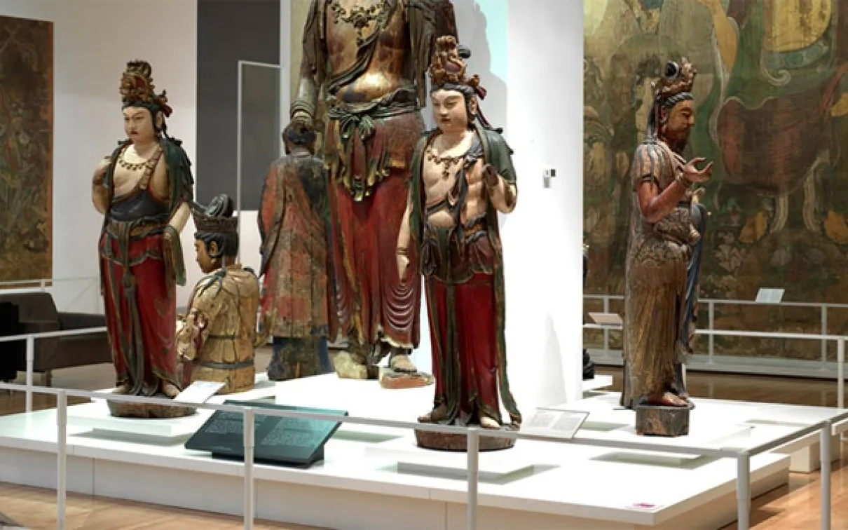 Bishop White Gallery of Chinese Temple Art, showing wooden Buddhist sculptures and wall murals in the ROM gallery