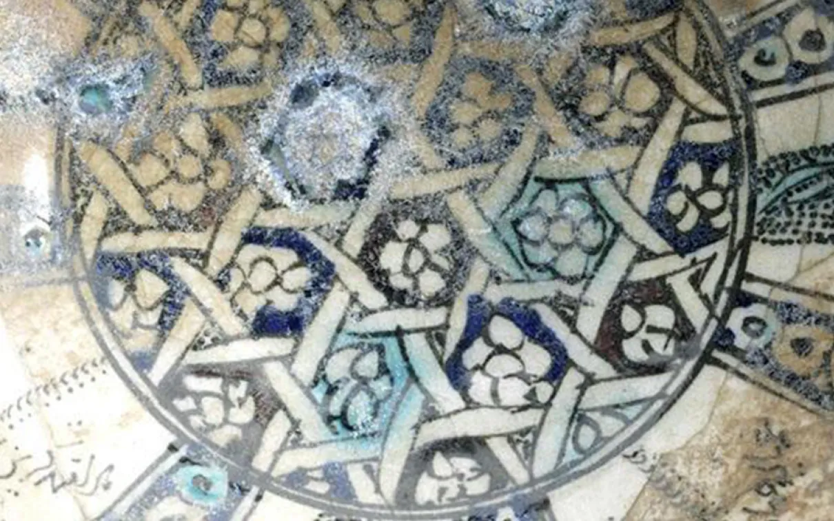 Stonepaste bowl Detail of bowl with geometric interlace pattern.