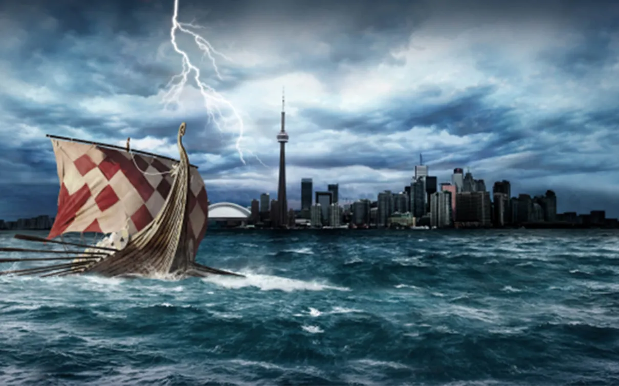 A Viking ship sailing before the Toronto skyline.