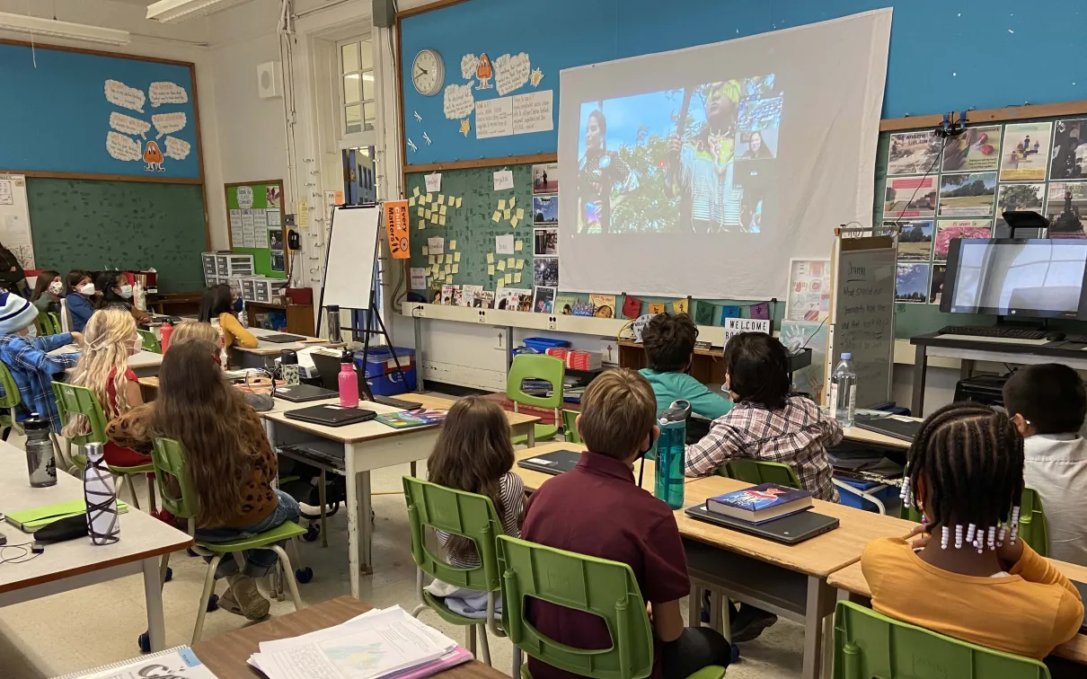 Leslie, pictured onscreen, teaches a class about Indigenous dance.